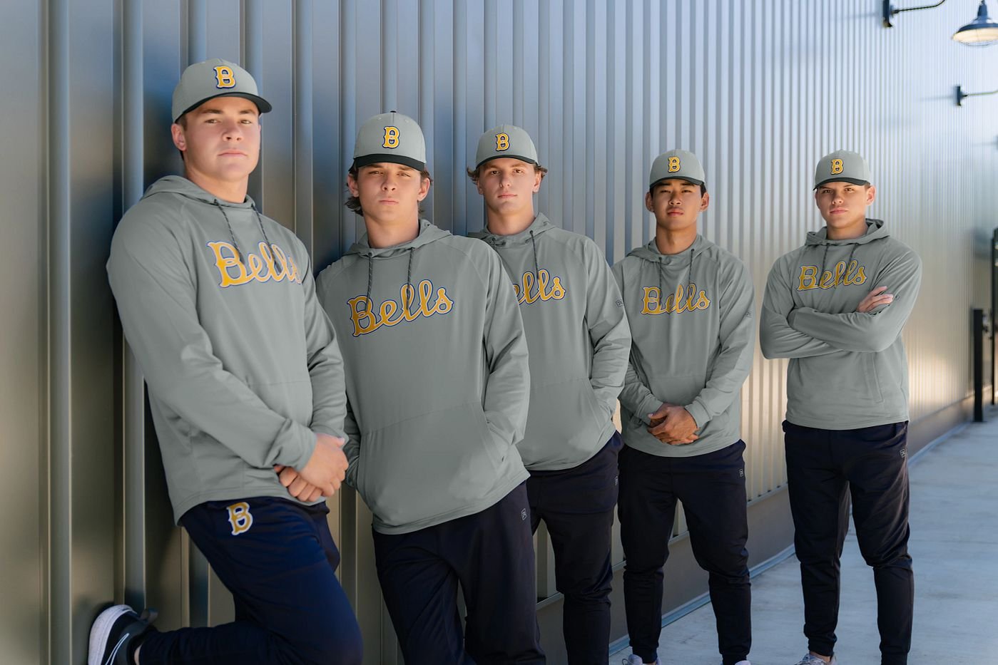 A team together in coordinated hoodies and caps