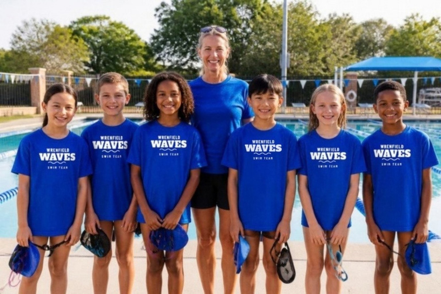 Demo: children of the fictional Wrenfield Waves neighborhood swim team in royal blue team tees printed across the front, holding caps and goggles on the pool deck